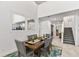 This spacious dining room features high ceilings and ample natural light, perfect for entertaining at 5637 Beggs Road, St Cloud, FL 34771