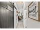 Hallway with a barn door, views to dining room and a powder room at 5637 Beggs Road, St Cloud, FL 34771