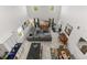 Aerial view of a spacious living room with modern furniture and high ceilings at 5637 Beggs Road, St Cloud, FL 34771