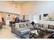 Open-concept living room with ample seating, adjacent to the kitchen area at 5637 Beggs Road, St Cloud, FL 34771