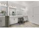 Bright main bathroom featuring tile floors, double vanity, makeup station, and neutral color palette at 5637 Beggs Road, St Cloud, FL 34771