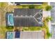 Aerial view of the home showcasing the roof, pool, and landscaping at 650 Old Bridge Cir, Davenport, FL 33897