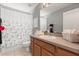 Bathroom with vanity, large mirror, and a shower-tub combination with a decorative curtain at 650 Old Bridge Cir, Davenport, FL 33897