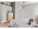 Cozy bedroom featuring a neutral color palette, a comfortable bed, and ample space, creating a relaxing retreat at 650 Old Bridge Cir, Davenport, FL 33897