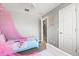 Shared bedroom showcasing two twin beds with themed bedding and pink canopies at 650 Old Bridge Cir, Davenport, FL 33897