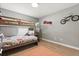 room features a bunk bed, playful wall decor, and a cozy carpeted floor at 650 Old Bridge Cir, Davenport, FL 33897