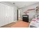 Bedroom with bunk beds, dresser, and a large closet for ample storage space at 650 Old Bridge Cir, Davenport, FL 33897