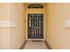 Inviting entryway with a dark front door and neutral tile flooring, creating a welcoming atmosphere at 650 Old Bridge Cir, Davenport, FL 33897