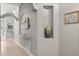 Neutral-colored hallway with decorative niches, providing an elegant transition between rooms at 650 Old Bridge Cir, Davenport, FL 33897