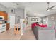 Bright living room with neutral walls, offering views of the kitchen and dining area at 650 Old Bridge Cir, Davenport, FL 33897