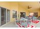 Inviting screened patio featuring a dining area, ample seating, and a seamless transition to outdoor enjoyment at 650 Old Bridge Cir, Davenport, FL 33897
