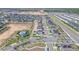Overhead shot of a modern residential area with a community pool, green spaces, and neatly arranged homes at 820 Overpool Ave, Davenport, FL 33896