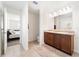 Bathroom with granite countertops, dual sinks, and an expansive vanity at 820 Overpool Ave, Davenport, FL 33896