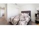 Cozy bedroom featuring a plush bed with soft pillows, complemented by a closet and storage shelf for added convenience at 820 Overpool Ave, Davenport, FL 33896