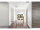 Dining room area with window view, features white chairs and wood table with bright natural light at 820 Overpool Ave, Davenport, FL 33896