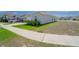 Well-maintained home with a two-car garage, driveway, and landscaping at 820 Overpool Ave, Davenport, FL 33896