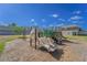 Gathering playground with slides and climbing, adjacent to newer construction homes, providing a fun recreational space at 820 Overpool Ave, Davenport, FL 33896