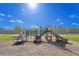 Playground featuring multiple slides and climbing structures set on a safe, wood chip surface at 820 Overpool Ave, Davenport, FL 33896