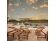 Luxury backyard pool with a rock waterfall, spa, and lounge chairs, perfect for relaxation at 9429 Golden Laurel Ln, Orlando, FL 32827