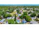 Aerial view of the neighborhood and surrounding landscape filled with lush greenery at 4710 Hatteras Ct, Orlando, FL 32808