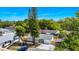 Aerial view of the property featuring the backyard, mature trees, and a long driveway at 4710 Hatteras Ct, Orlando, FL 32808