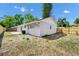 The backyard features a patio, a new privacy fence and an AC unit at 4710 Hatteras Ct, Orlando, FL 32808