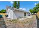 Backyard showcasing a sliding glass door to the patio and access to storage at 4710 Hatteras Ct, Orlando, FL 32808