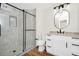Modern bathroom featuring a glass door shower, granite countertop and black hardware accents at 4710 Hatteras Ct, Orlando, FL 32808