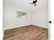 Bedroom featuring wood-look flooring and a window at 4710 Hatteras Ct, Orlando, FL 32808