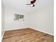 Bedroom with neutral walls, wood-look flooring, and a ceiling fan at 4710 Hatteras Ct, Orlando, FL 32808