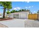 Beautifully renovated single-story home boasting a freshly painted exterior, new driveway and updated landscaping at 4710 Hatteras Ct, Orlando, FL 32808