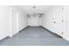Spacious garage with epoxy flooring and a new garage door at 4710 Hatteras Ct, Orlando, FL 32808