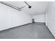 Spacious garage with epoxy flooring and a new garage door at 4710 Hatteras Ct, Orlando, FL 32808