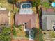 This aerial view showcases a private pool, backyard playground, and well-maintained landscaping at 1026 Manchester Cir, Winter Park, FL 32792