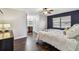 Comfortable bedroom featuring modern dark wood floors, blue accent wall, and closet at 1026 Manchester Cir, Winter Park, FL 32792