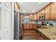 Well-equipped kitchen features stainless steel appliances and granite countertops at 1026 Manchester Cir, Winter Park, FL 32792