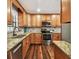 Well-equipped kitchen featuring stainless steel appliances and granite countertops at 1026 Manchester Cir, Winter Park, FL 32792