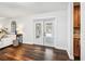 Bright and airy living room featuring hardwood floors with access to the lanai at 1026 Manchester Cir, Winter Park, FL 32792