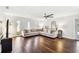 Bright and airy living room featuring hardwood floors and a comfortable sectional sofa at 1026 Manchester Cir, Winter Park, FL 32792