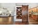 Spacious living area with hardwood floors, open shelving and a sliding barn door at 1026 Manchester Cir, Winter Park, FL 32792