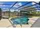 Sparkling screened-in swimming pool offering a refreshing oasis for outdoor enjoyment at 1026 Manchester Cir, Winter Park, FL 32792