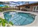 Inviting screened-in pool area with clear blue water, outdoor seating, and a relaxing backyard ambiance at 1026 Manchester Cir, Winter Park, FL 32792