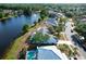 Aerial view showing home with pool and nearby lake with fountain at 11160 Sylvan Pond Cir, Orlando, FL 32825