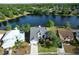 Aerial shot of the property showcasing the lake, pool, and neighborhood at 11160 Sylvan Pond Cir, Orlando, FL 32825