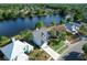 Aerial view of home near lake featuring a fountain at 11160 Sylvan Pond Cir, Orlando, FL 32825