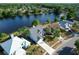 Aerial view of home near lake featuring a fountain at 11160 Sylvan Pond Cir, Orlando, FL 32825