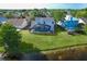 Aerial backyard view featuring screened pool and lake at 11160 Sylvan Pond Cir, Orlando, FL 32825