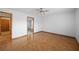 Cozy bedroom featuring wood floors and neutral paint color at 11160 Sylvan Pond Cir, Orlando, FL 32825