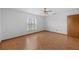 Bedroom featuring wood floor, ceiling fan and bright light at 11160 Sylvan Pond Cir, Orlando, FL 32825