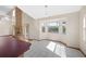 Bright dining area featuring tiled floors, a large window and a fireplace at 11160 Sylvan Pond Cir, Orlando, FL 32825